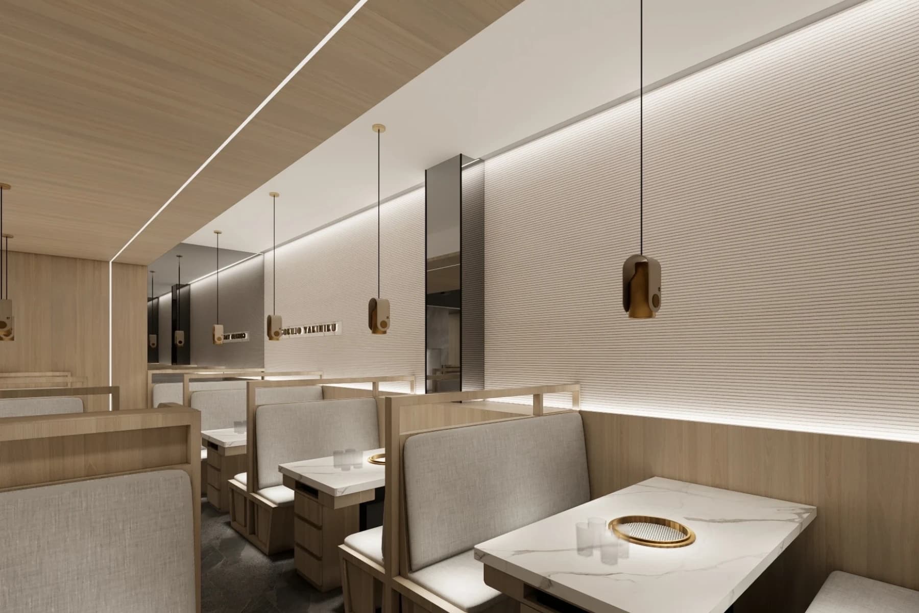 高端餐飲空間設計案例，老井燒肉二樓卡座沙發區，極簡石文壁面搭配精緻吊燈，體現回歸本質的靜謐氛圍。